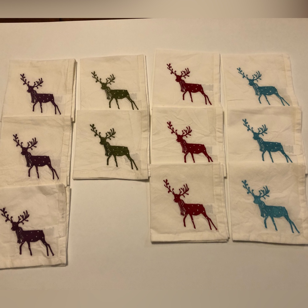 11 Cotton embroidered holiday cocktail napkins.